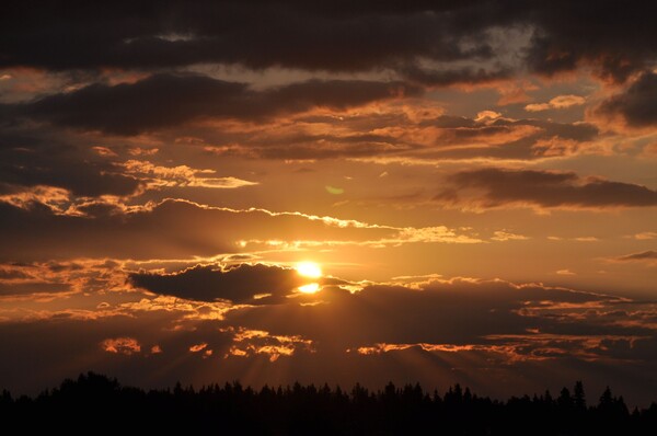 Sun rays through clouds, beautiful sky